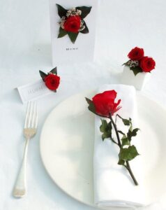 Red preserved roses as table decorations