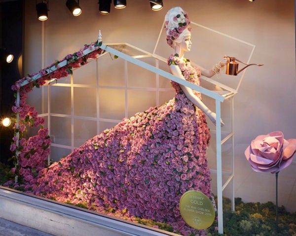 A window display featuring hundreds of preserved roses.